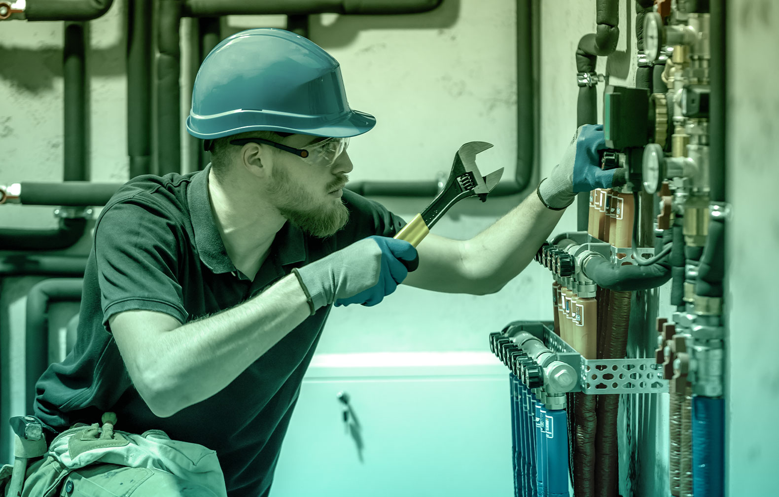 maintenance technician adjusting tightness on a valve