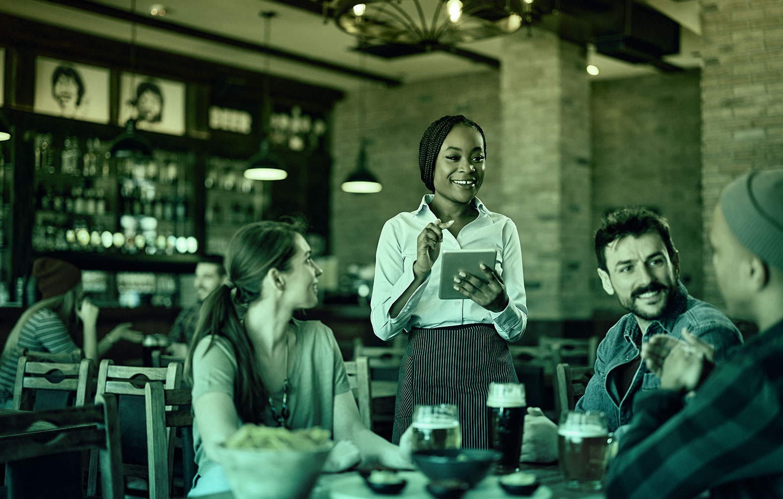 waitress serving a table which is also an asset for the restaurant industry
