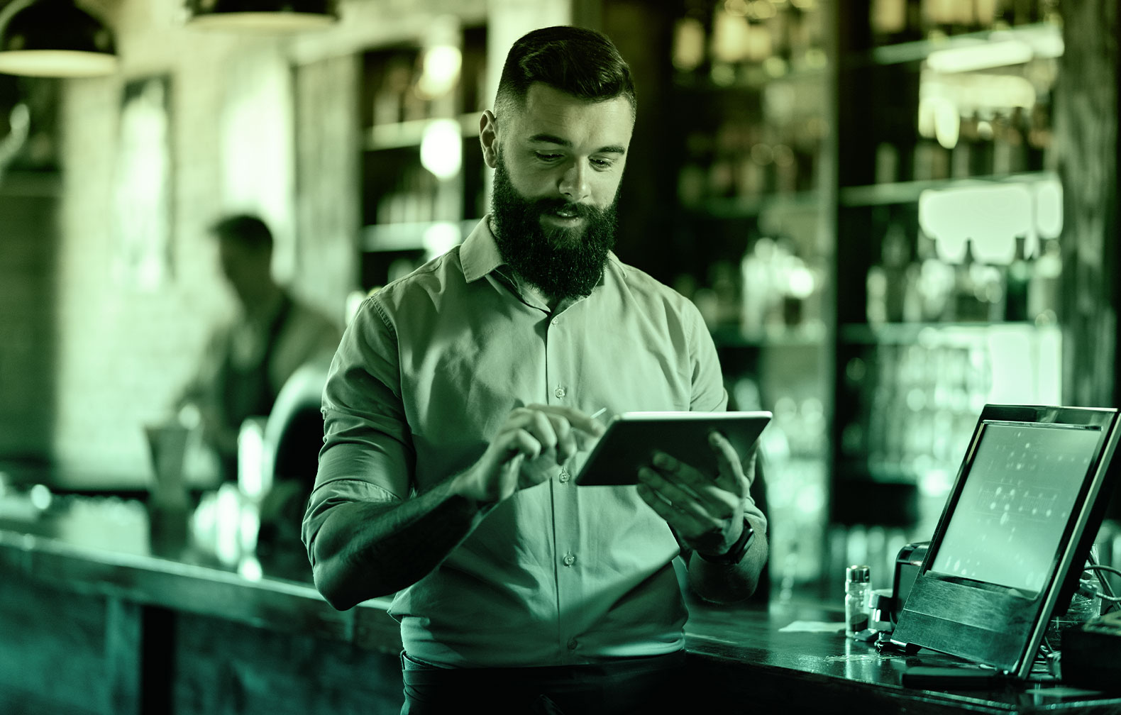 waiter taking orders in his tablet which a restaurant asset that must be maintained