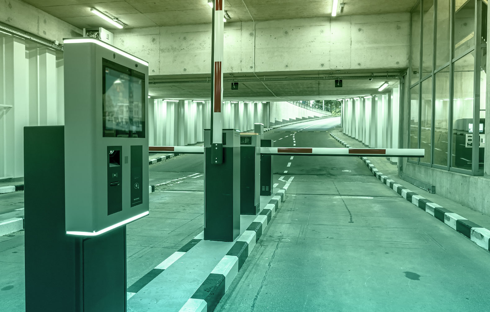 parking garage entrance showing ticket dispenser and barrier arm gate are both assets that require periodic maintenance and critical for the operation of the parking garage. Breakdown and idle time directly impact revenue stream for the business
