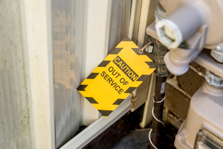 Caution out of service tag to mark that a machines is out for maintenance. Predictive maintenance with a CMMS like CMMShere can drastically reduce downtime in machines such as this