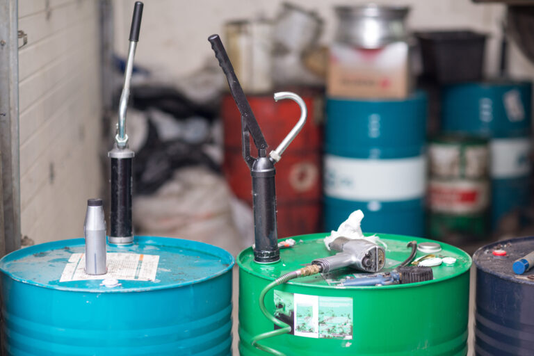maintenance management for maintenance lubricants. The image shows barrels of lubricants three in the foreground and 4 in the background out of focus.