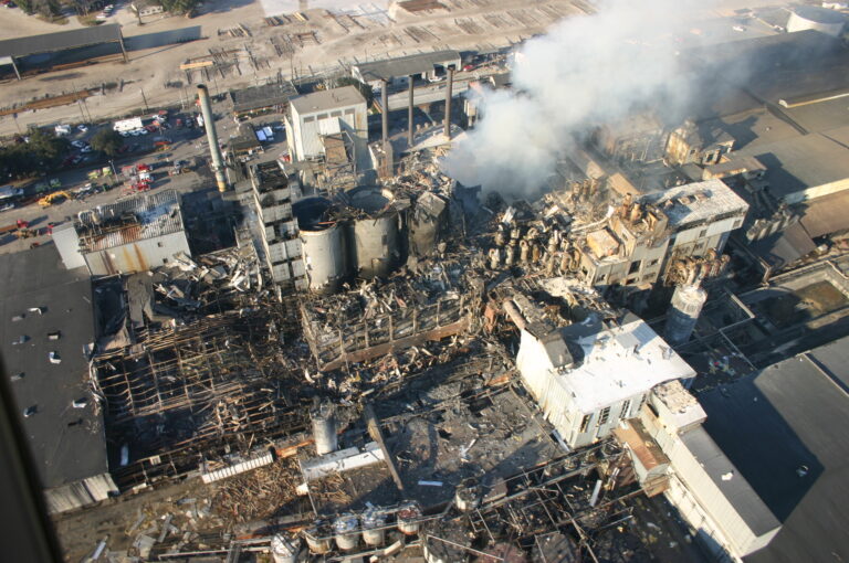 Aerial view of the destruction at Imperial sugar factory accident due to lack of maintenance. A CMMS makes maintenance effective to avoid industrial accidents
